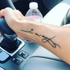 a person's arm with a tattoo that says love and an arrow on it