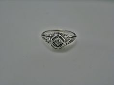 "For Sale: (1) H108 Gorgeous Diamond Ring in 14k White Gold from 1930's PLEASE READ ENTIRE DESCRIPTION BEFORE PURCHASING Please see pictures for more details! This stunning ring features a center 0.06 ct diamond. This is a beautiful filigree mounting down the side. The shank is decorated half way down. The ring is not stamped 14k, but was tested for it. This ring is from the 1930's. A beautiful piece for a any special occasion! What a great Gift! Specifics: *14k White Gold *Center Diamond approx Vintage Diamond Ring, Vintage Diamond Rings, Filigree Design, Filigree Ring, Way Down, Silver Chain Necklace, Saint Louis, Wristwatch Men, Vintage Diamond