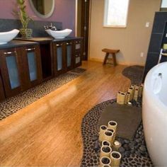 a bathroom with two sinks and a large bathtub in it's center area