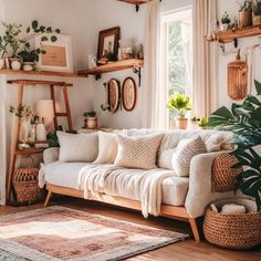 a living room filled with lots of furniture and plants on top of wooden shelving