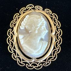 This vintage brooch and pendant combo is a unique addition to any jewelry collection. The intricate filigree design is made of 12k yellow gold filled metal, and features a beautiful oval-shaped shell cameo as the main stone. This piece is signed and comes from Italy, adding to its rarity. Perfect for those who appreciate fine jewelry, this brooch pendant can be worn on a variety of occasions. Its vintage charm and delicate details are sure to catch the eye of anyone who sees it. Add it to your c Victorian Brooches With Intricate Design, Victorian Brooch With Intricate Design For Formal Events, Victorian Brooches With Intricate Design For Formal Wear, Victorian Brooches With Intricate Design For Formal Occasions, Victorian Brooches With Intricate Design For Formal Events, Antique Engraved Collectible Brooches, Antique Brooch With Intricate Pendant Design, Antique Pendant Brooch With Intricate Design, Antique Yellow Gold Brooches With Intricate Design