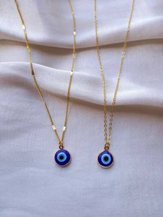 24K gold plated handmade choker necklace with a blue evil eye pendant 2 chain styles available, choose your favourite! Chain length:17 inches (~43cm) Chain length may be shortened FREE of charge, please add the length you would like in the personalisation box below upon ordering or message me! Everything comes beautifully wrapped, with a small jewellery pouch, thank you note and care instructions If this is a gift, you can also include a birthday message (and order will be sent through the letterbox) Great gifts for yourself, friends, family, partner Non-tarnish FREE STANDARD DELIVERY on all UK Orders Worldwide delivery available You can upgrade delivery options at the check out Message me if you have any questions/would like more details about anything! Check out my shop for more unique h Blue Gold-plated Chain Necklace As Gift, Blue Gold Plated Chain Necklace As Gift, Everyday Handmade Blue Charm Necklaces, Evil Eye Choker Necklace As Gift, Evil Eye Choker Necklace For Gift, Blue Adjustable Gold-plated Chain Necklace, Blue Adjustable Gold Plated Chain Necklace, Blue Gold-plated Chain Necklace With Adjustable Chain, Blue Charm Necklace With Adjustable Chain For Everyday