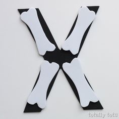 the letter x is made up of black and white strips