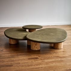 two circular tables sitting on top of a hard wood floor