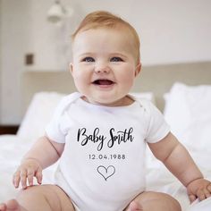 Our Personalised New Baby Vest is perfect for the new arrival, gift it as a gift at the baby shower or use it as a new baby announcement. This New Baby Gift includes the baby's due date and the surname. Vest Features: - 65% Polyester, 35% Cotton - 200gsm (approx) - Supersoft - Wash care label - 3 nickel free press buttons - Weight 145gsm - Wash at 30 degrees, inside out, do not tumble dry, iron on reverse  ----------------------------------------- POSTAGE TIMES Please see the processing times on Personalized White Bodysuit For Gift, White Onesie With Name Print For Gift, Personalized White Onesie As A Gift, Personalized White Onesie As Gift, Personalized White Onesie For First Birthday, Personalized White Bodysuit For First Birthday, White Personalized Bodysuit For First Birthday, White Bodysuit With Name Print For First Birthday, Baby Arrival Announcement