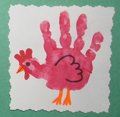 a child's handprint with a turkey on it