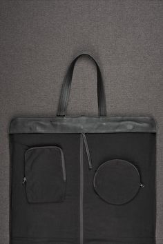 Leather Garment Bag · Black by Capra Black Shoulder Bag With Zipper Pocket For Business Trips, Black Bags With Functional Pockets For Business Trips, Black Briefcase With Zipper Pocket For On-the-go, Black Travel Briefcase With Zipper Pocket, Travel Briefcase Black With Zipper Pocket, Functional Black Briefcase With Zipper Pocket, Travel Briefcase With Zipper Pocket In Black, Versatile Black Briefcase With Zipper Closure, Modern Black Briefcase With Zipper Pocket