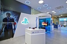 a playstation store with an advertisement on the wall