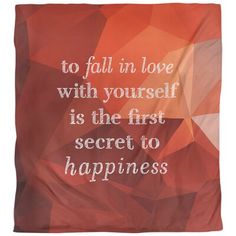 a red and orange blanket with the words to fall in love with yourself is the first secret to happiness