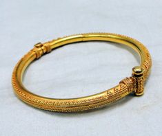 "vintage 22 k gold handmade bangle bracelet. Weight-35 grams,Inner diameter-6.2 cm(2.44\"), total inner circumference-19.46 cm (7.66\") we can adjust size, width-5 mm, material-22 k gold." Luxury 22k Gold Temple Jewelry Bracelets, Yellow Gold Hand Set Temple Jewelry Bangle, Luxury 22k Gold Hand Set Bangle, Luxury Gold Bangle For Festive Season, Traditional 22k Gold Bangle Bracelet, Ceremonial Temple Jewelry Gold Bracelet, Luxury Gold Cuff Bracelet For Ceremonial Use, Luxury Gold Cuff Bracelet For Ceremonial Occasions, Luxury 22k Gold Bangle For Ceremonial Occasions