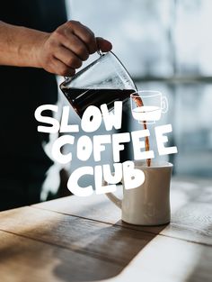 a person pours coffee into a cup with the words slow coffee club on it