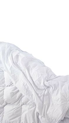 an unmade bed with white sheets and pillows