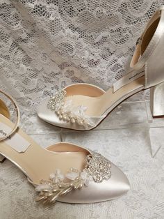 "Bling Wedding shoes closed toes, square heels, ankle straps. Featuring a beautiful crystals flowers, vintage lace appliqués, and vintage asares. I only have materials for 14 pairs. Heel: 2.5\" Colors: White, Off-white, and Ivory. US Sizes: 5, 5.5, 6, 6.5, 7, 7.5, 8, 8.5, 9, 9.5, 10. M width. Outside USA, please goggle a shoe size chart converter, or contact for help! Style: Vintage 20's -40's Great Gatsby, Flapper shoes! Please look at all the pictures TO BUY COLOR SWATCH SAMPLES: to view color Vintage White Heels For Wedding, Vintage Wedding Heels With Pointed Toe, Vintage High Heel Wedding Shoes, Vintage Heels With Pointed Toe For Wedding, Vintage Pointed Toe Heels For Wedding, Vintage Wedding Heels With Round Toe, Vintage Wedding Shoes With Almond Toe, Vintage Round Toe Heels For Wedding, Vintage Closed Toe Wedding Shoes