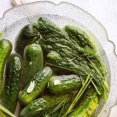 cucumbers in a glass bowl on a table