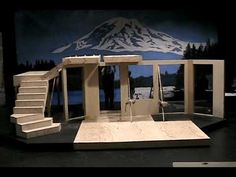 the stage is set up for an outdoor play area with stairs and steps leading to a mountain