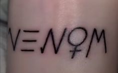 a close up of a person's arm with the word mom written on it