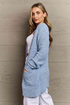 This sweater offers a luxuriously soft and cozy feel that will keep you warm during the colder months. The timeless design features long sleeves and convenient pockets, adding both functionality and charm to your outfit. Whether you're lounging at home or stepping out for a casual day, this cardigan is a must-have addition to your wardrobe, effortlessly elevating any ensemble with its versatile and fashionable appeal. Pattern type: Solid Style: Casual Features: Pocketed Neckline: Open front Leng Blue Popcorn, Kimono Sweater, Longline Cardigan, Saint John, Fall For You, Stepping Out, Everyday Wardrobe, Pastel Blue, Front Open