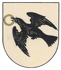 a black and white coat of arms with an eagle holding a key ring in it's beak