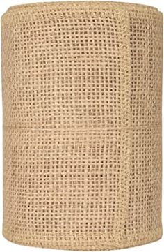 a round lamp shade made out of burlocked jute fabric on an isolated white background