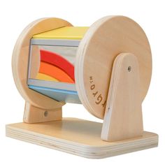 a wooden spinning toy with multiple colors on it