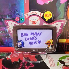 a computer screen with the words big man loves you written on it in front of other cartoon characters