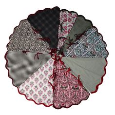 six pieces of fabric on top of each other in different colors and patterns, with red trim