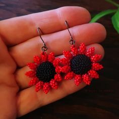 Heart in Hawaii Mini Beaded Sunflower Earrings - Red and Matte Black Adjustable Red Flower Beaded Earrings, Red Tiny Beads For Crafting, Handmade Red Flower Beaded Earrings, Red Beads For Crafting, Gift Red Beaded Earrings With Bead Caps, Black Flower-shaped Jewelry With Colorful Beads, Handmade Red Flower Jewelry, Adjustable Red Beaded Earrings With Black Beads, Handmade Red Beads For Crafting