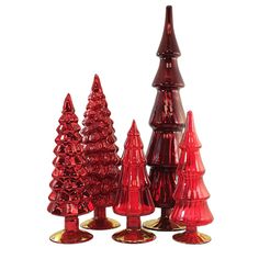 red glass christmas trees are lined up against a white background