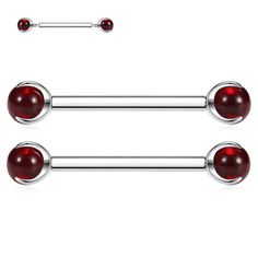 two red glass balls are attached to the barbells, and one is silver