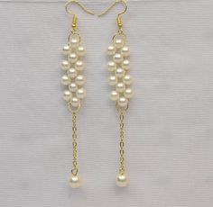 This is Indian test of earrings perfect for wedding and party. White Pearl Linear Earrings For Formal Occasions, White Pearl Chain Linear Earrings For Party, Formal White Pearl Chain Chandelier Earrings, Elegant Handmade Linear Earrings For Parties, Elegant Handmade White Linear Earrings, Elegant White Handmade Linear Earrings, Party Long Drop Pearl Bridal Earrings, Pearl Long Drop Earrings For Party, Long Drop Pearl Earrings For Party