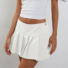 Indulge in the sophisticated style of our Preppy Hottie Pleated Skirt. Its elegant pleats and luxurious fabric create a tastefully exclusive look. Perfect for any occasion, this skirt is a must-have for any fashion lover. Elevate your wardrobe with this premium piece. Features: -85% Polyester -Low Waist -Solid Color -Pleated Design -Regular fit -Preppy style Formal Fitted Mini Skirt With Accordion Pleats, Elegant Solid Color Party Mini Skirt, Chic Pleated Skirt In Solid Color, Pleated Skirted Skort, Chic Pleated Mini Skirt In Color, Solid Stretch Pleated Mini Skirt, Fitted Solid Skort With Pleated Hem, Elegant Solid Color Mini Pleated Skirt, Elegant Solid Color Pleated Mini Skirt