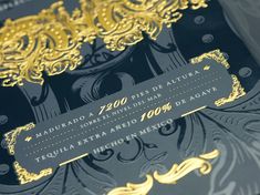 an ornate black and gold wedding card