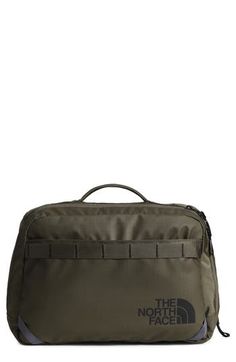 the north face toiletry bag in olive green with grey trim and zipper closures