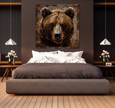 a large brown bear is on the wall above a bed in a room with wood flooring