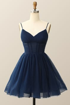 This majestic navy blue A-line treat features an alluringly pleated see-through bodice with delicate spaghetti straps, crafted from the finest tulle material. It culminates with a sublimely zippered back and falls above the knee. Short Homecoming Dresses Blue, Navy Blue Homecoming Dress Short, Cute Formal Dresses Short Blue, Star Homecoming Dress, Hoco Dresses Midnight Blue, Deep Blue Homecoming Dresses, Pretty Navy Blue Dresses, Above The Knee Dress Formal, Navy Blue Short Dress Casual