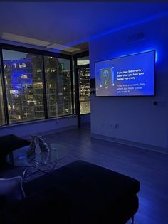 a living room filled with furniture and a flat screen tv mounted to the side of a wall