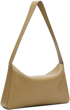 Nappa calfskin shoulder bag in taupe. · Fixed shoulder strap · Logo embossed at face · Magnetic flap · Patch pocket at interior · Faille lining · H6.5 x W12 x D2.5 Supplier color: Grain terra Designer Soft Leather Baguette Shoulder Bag, Designer Beige Leather Baguette Bag, Beige Leather Baguette Bag For Formal Occasions, Evening Shoulder Bag With Smooth Grain In Beige, Beige Smooth Grain Shoulder Bag For Evening, Modern Beige Leather Baguette Bag, Evening Beige Smooth Grain Shoulder Bag, Beige Rectangular Shoulder Bag With Smooth Grain, Beige Leather Baguette Bag