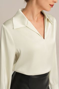 Experience the epitome of elegance with our Satin Blouse. Combining a loose fit with a smooth and comfortable fabric, this blouse is designed to make you feel effortlessly stylish. With long sleeves, a flattering V-neck, and a lapel collar, this piece exudes timeless charm. Material : 95%Polyester+5%Elastane.Elasticity : Low Stretchy.Sku : CL2156A23Package : 1*TopsCare instructions: Max wash temp: 30℃, No bleach, No tumble dry, Iron max 110℃, Wash dark colors separately, No PU ironing. Formal V-neck Solid Color Tops, Chic Solid Blouse With Collared Neckline, Chic Solid Color Blouse With Collared Neckline, Elegant Collared Tops In Solid Color, Classic V-neck Blouse For Semi-formal Occasions, Elegant V-neck Blouse For Office, Beige V-neck Blouse For Office, Chic Solid Color V-neck Shirt, Chic Collared Top For Semi-formal Occasions