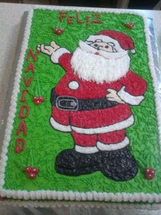 a cake decorated like santa clause on top of a table