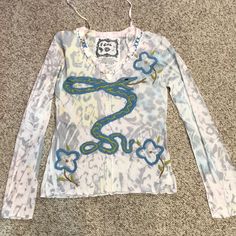 This Is Such A Cool Top! The Tag Says Size Large But I�’m Listing It As A Medium Because I Really Do Think This Boutique Brand Runs Small. Material Is Cotton. Size Laid Flat Is: Waist 14 1/2. New With Manufacture Tag, Never Worn. Trendy Embroidered V-neck Tops, Embroidered Stretch Long Sleeve Tops, Stretch Embroidered Long Sleeve Tops, Embroidered Stretch Cotton Tops, Casual V-neck Top With Floral Embroidery, Spring V-neck Y2k Tops, Spring Y2k V-neck Tops, Casual Embroidered Long Sleeve Tops, Y2k Floral Print Top For Spring