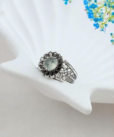 Aqua Chalcedony Antique Silver Women Ring, 925 Sterling Silver Designer Handmade Boho Filigree Floral Statement Cocktail Ring Silver flower ring, oxidized silver ring, cool ring gift, trendy women ring, ring for women, daisy design ring, dainty mom ring, delicate jewelry, blue silver ring, silver ring for her, tiny statement ring, stackable ring, antique floral ring, one of a kind ring Material: 925 Sterling Silver ( NICKEL FREE ) Gemstone: Aqua Chalcedony 6 mm. -Aqua Chalcedony is a traditional birthstone for March. FREE, FAST AND TRACKABLE SHIPPING FOR ALL EU COUNTRIES AND USA. COMES WİTH VELVET POUCH AND LUXURY GİFT BOX. This ring is a nod to an old school favorite, the bohemian daisy brooch. Our chalcedony silver vintage floral daisy is wrapped in a classy filigree band that's finished Antique Style Rings, Oxidized Silver Rings, Silver Flower Ring, Mom Ring, Daisy Design, Aqua Chalcedony, Jewelry Blue, Ring Antique, Women Ring