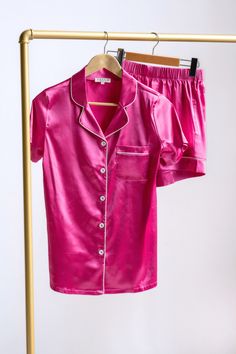 The lustrous hot pink Margo Human Pajama Set adds a touch of glamour to your bedtime routine, making you feel like royalty even when you're winding down for the night. The fabric's gentle caress against your skin will provide unrivalled comfort, ensuring a peaceful and restful sleep. Details Fabric: Polyester, SpandexDesign: Hot pink silky pajama shirt & short setSizing: True to size with a stretch Hot Pink Pajamas, Neon Pajamas, Pink Satin Pajamas, Pink Silk Pajamas, Neon Disco, Royal Knight, Pink Pjs, Birthday Sleepover, Bach Bash