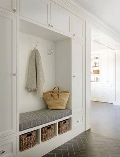 a large white closet with some baskets on it