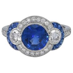 Sophia D platinum ring with an exquisite blue sapphire center weighing a total of 2.00 carat. Encompassing the center are round diamonds with the weight of 0.52 carat, sapphires weighing 0.40 carats and diamonds with the weight of 0.24 carat. Ring is 6.5 and available for resizing. Sophia D by Joseph Dardashti LTD has been known worldwide for 35 years and are inspired by classic Art Deco design that merges with modern manufacturing techniques. Sapphire Art Deco Ring, Stunning Aesthetic, Royal Jewels, Deco Ring, Deco Jewelry, Platinum Ring, Blue Sapphire Rings, Pretty Rings, Sapphire Jewelry