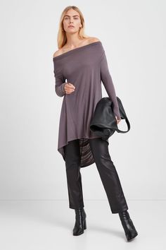 Transformative pieces like our Yorkville Tunic work hard to make you look good, so you don't have to. She's fashioned from flowy sheer material with a multi-way neckline you can wear as a cowl-neck, or completely off-shoulder. Her long sleeves are complete with thumbholes for a touch of athleisure-luxe, and her back dips with a dramatic drape for the ultimate exit.[SPLIT] Maritza, in anthracite, is 5'9.5" (177 cm) tall, wearing size XS. Sam, in light beige, is 5'8" (173 cm) tall, wearing size XS Versatile Evening Tops For Fall, Chic Long Sleeve Viscose Tunic, Chic Oversized Tops For Evening, Oversized Blouse For Night Out In Fall, Stretch Viscose Blouse For Fall, Stretch Tunic For Fall, Chic Fitted Tunic For Fall, Flowy Versatile Tops For Fall, Flowy Fall Blouse For Night Out