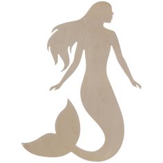 a wooden cutout of a mermaid with long hair and tail, standing in front of a white background