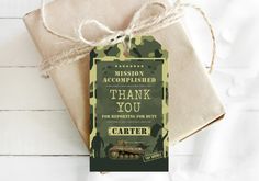 an army themed thank you card is tied to a gift bag