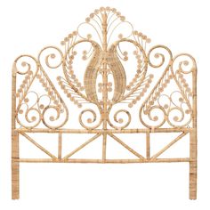 the headboard is made out of wicker and has an intricate design on it