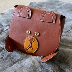 Brand New Real Leather Mini Bag. It Is A Cute Shy Bear Design. A Little Bit Dented At Right Eye During Shipment Therefore I Am Letting Go At Discounted Price, What You See Is What You Get. Great For Little Girl Gift! Size Is Approx 7-8.5”X6.5” Leather Mini Bag, Handcrafted Bags, Craft Bags, Bear Design, Leather Mini, Leather Crossbody Bag, Real Leather, Leather Crossbody, Mini Bag