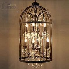 a birdcage filled with lots of lights hanging from it's ceiling fixture